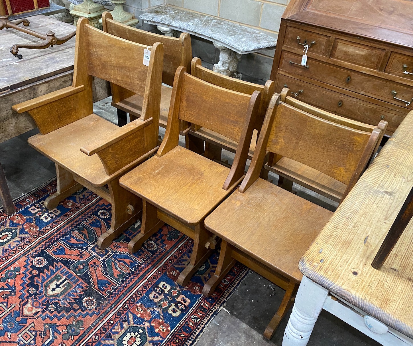 A set of six Gothic style oak dining chairs including a pair of carvers